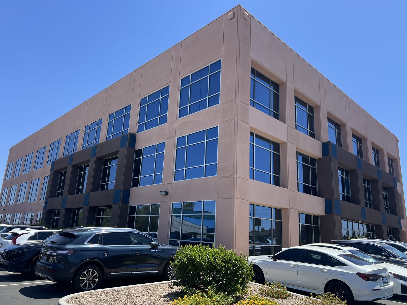 Three-story Las Vegas commercial office building with blue solar-tinted window walls