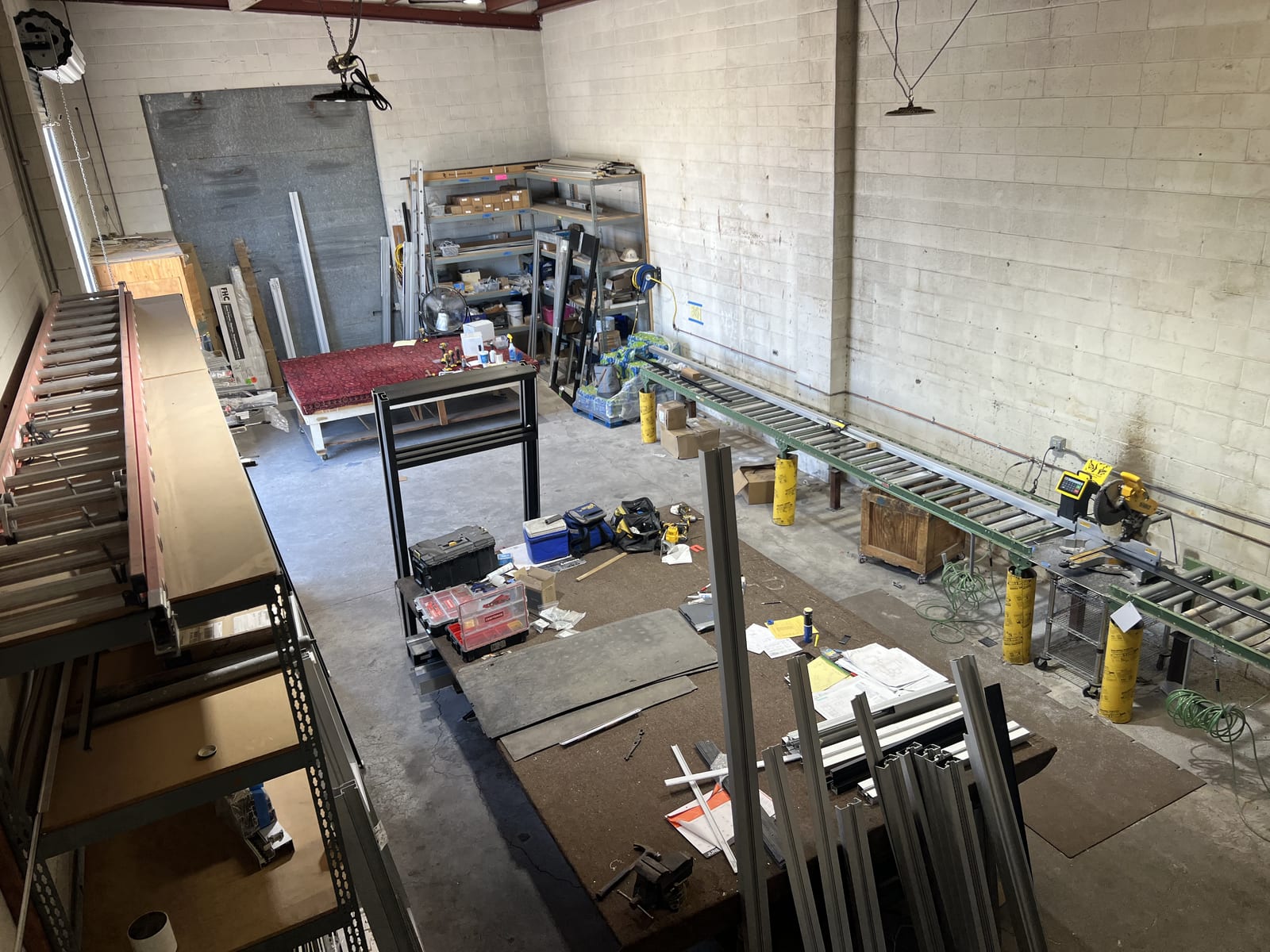 Custom Glass Cutting in Las Vegas: Any Size, Any Shape 2 Silver State Glass fabrication shop with a chop saw, roller conveyor and racked glass stock