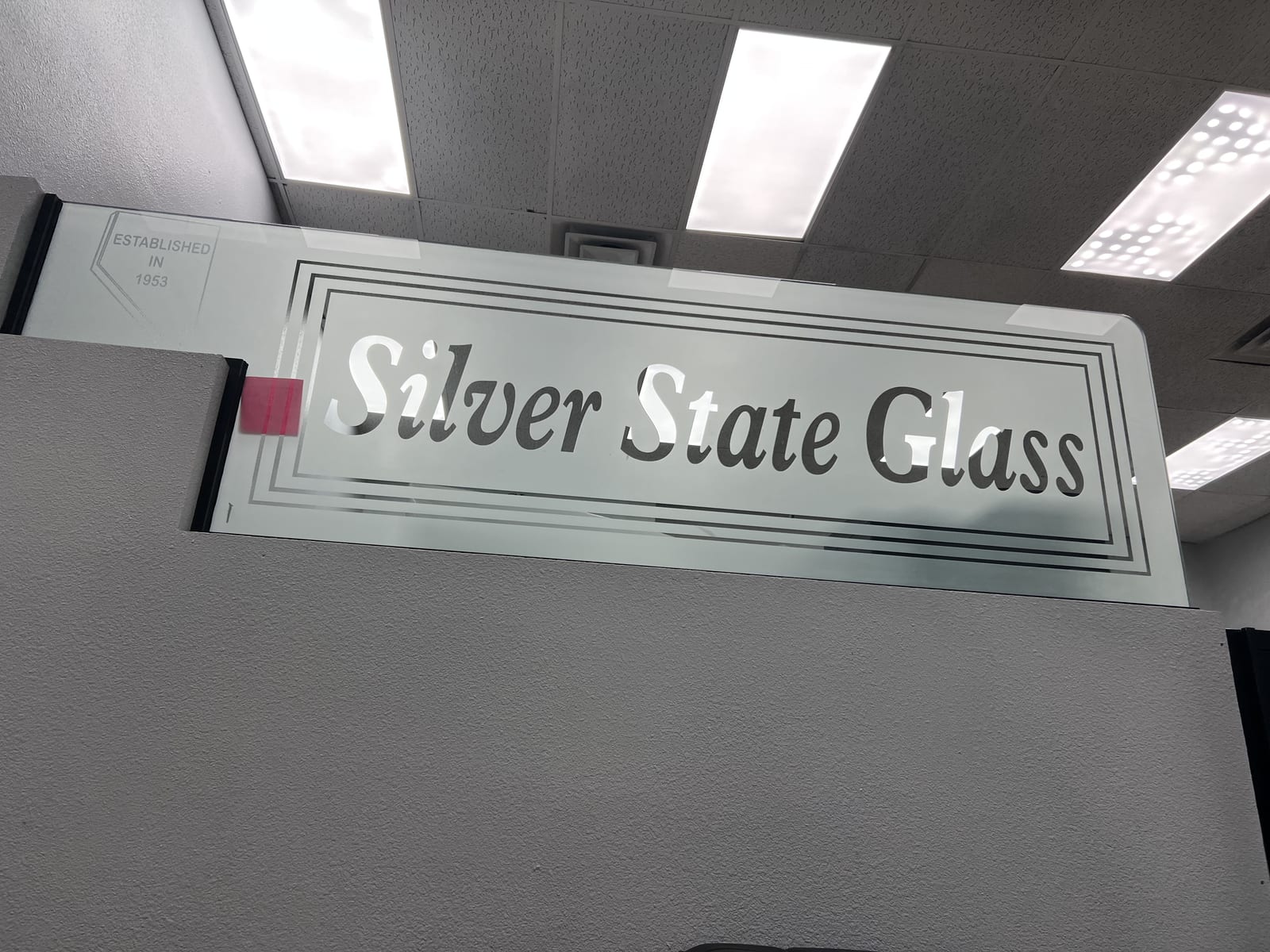 Etched and frosted glass sign reading Silver State Glass, established in 1953