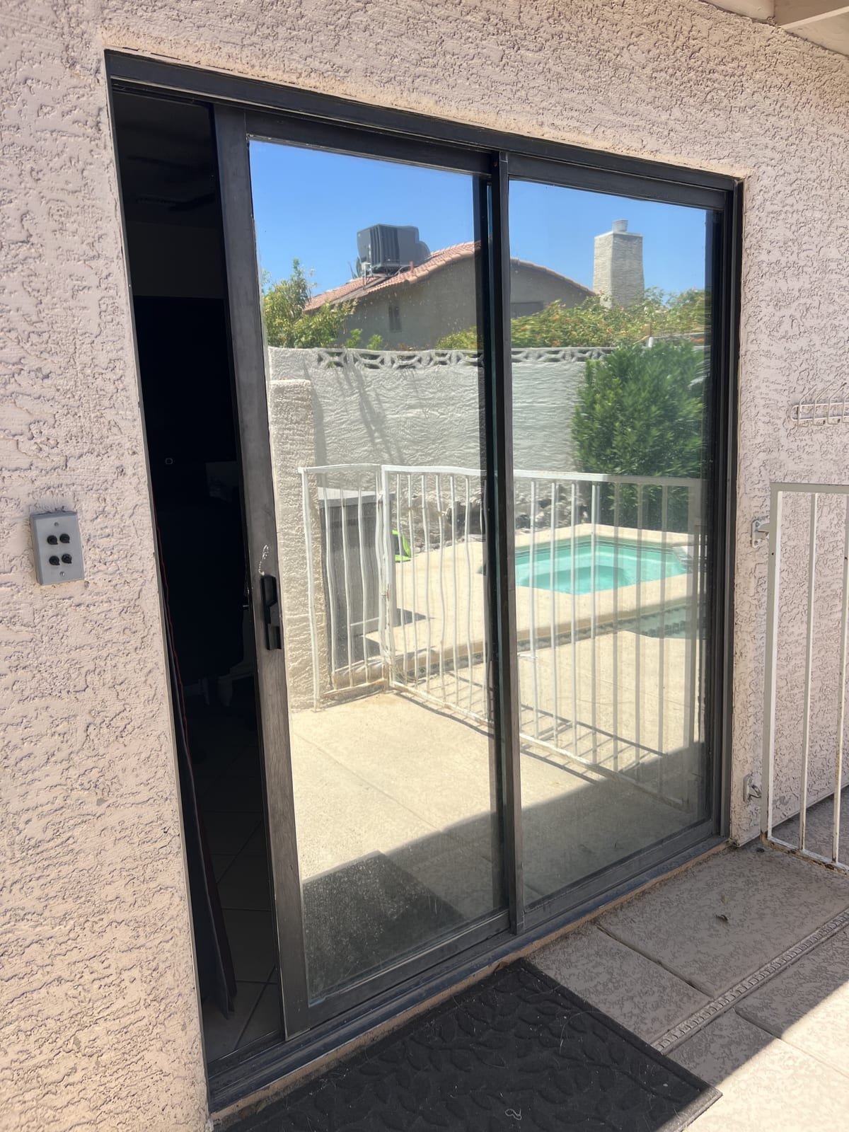 Glass Project Gallery Las Vegas 31 A sliding patio door onto a pool deck