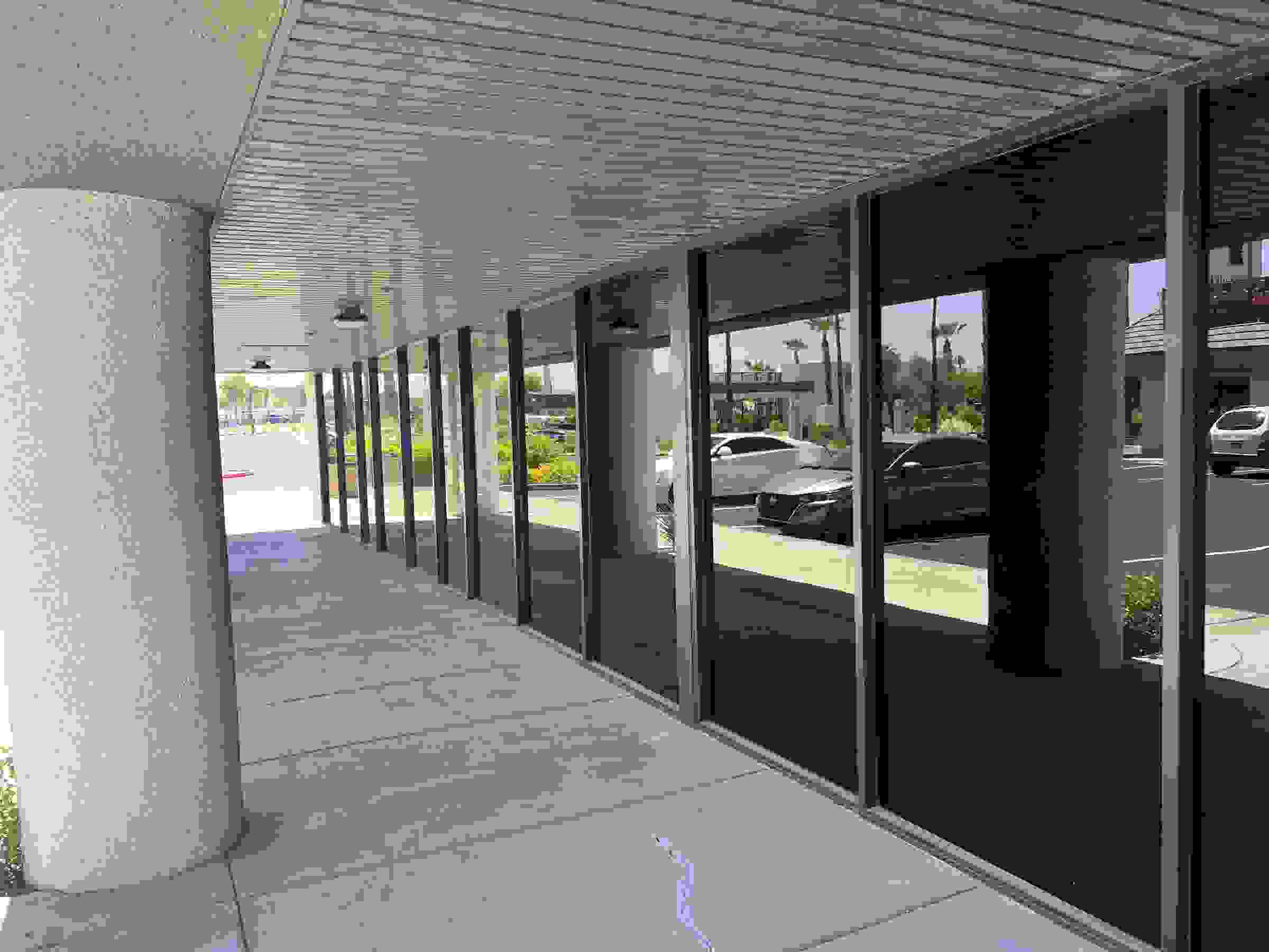 Covered commercial walkway lined with tinted storefront glass in Las Vegas